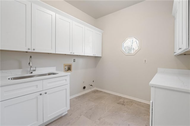 laundry area featuring gas dryer hookup, cabinets, washer hookup, and sink