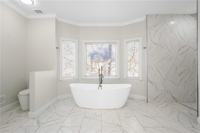 bathroom with ornamental molding, toilet, and a bathing tub