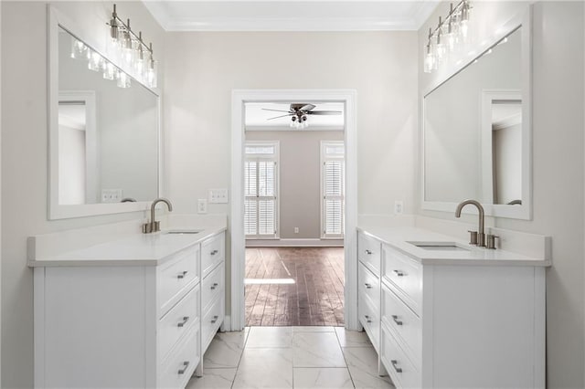 bathroom featuring vanity, ornamental molding, and ceiling fan