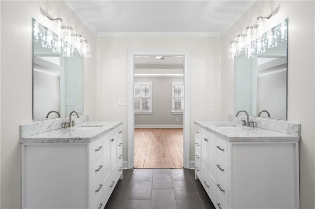 bathroom with vanity, tile patterned floors, and crown molding