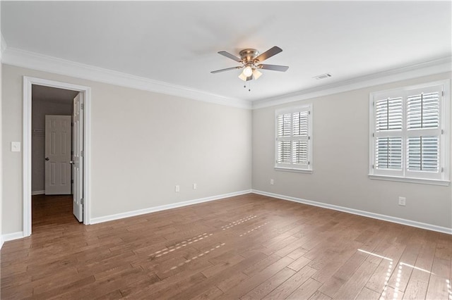 spare room featuring ornamental molding, dark hardwood / wood-style floors, and ceiling fan