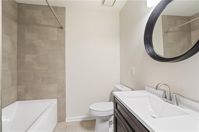 bathroom featuring vanity, tile patterned floors, and toilet