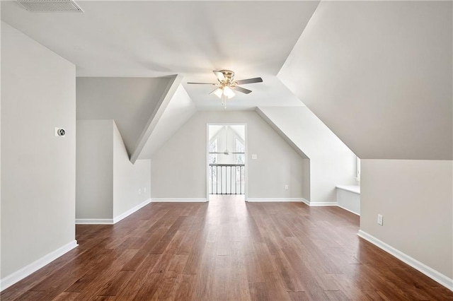 bonus room featuring dark wood-type flooring, ceiling fan, and lofted ceiling