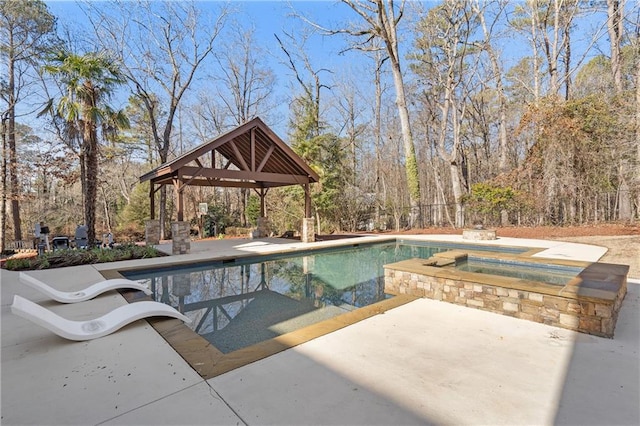 view of swimming pool with a gazebo, an in ground hot tub, and a patio