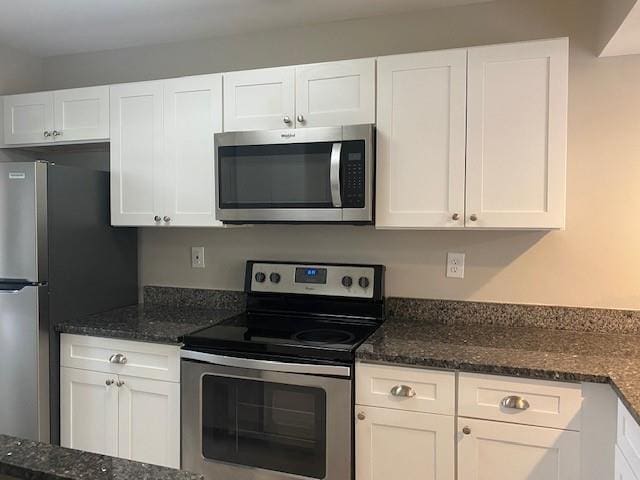 3241 Turner St, East Point, GA 30344 - kitchen featuring appliances with stainless steel finishes and white cabinets