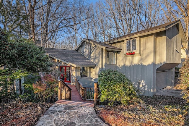 view of front of house with a garage and french doors