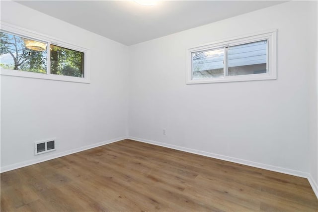 1894 Evans Dr SW, Atlanta, GA 30310 - unfurnished room with visible vents, baseboards, and wood finished floors