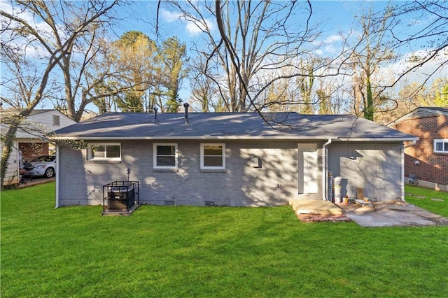 1894 Evans Dr SW, Atlanta, GA 30310 - rear view of house with crawl space, a patio area, brick siding, and a yard
