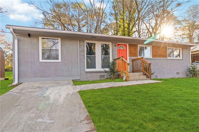 ranch-style home with a front lawn, brick siding, and crawl space