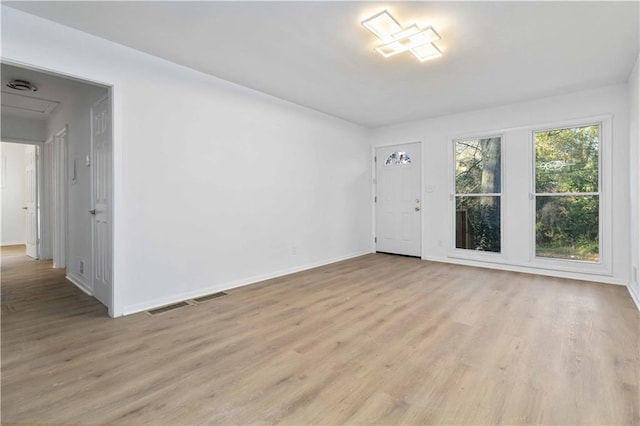 1894 Evans Dr SW, Atlanta, GA 30310 - empty room featuring visible vents, light wood-type flooring, and baseboards