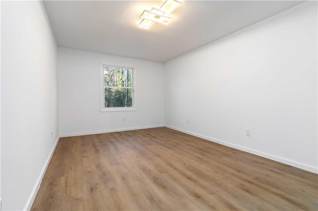 1894 Evans Dr SW, Atlanta, GA 30310 - unfurnished room with baseboards and wood finished floors