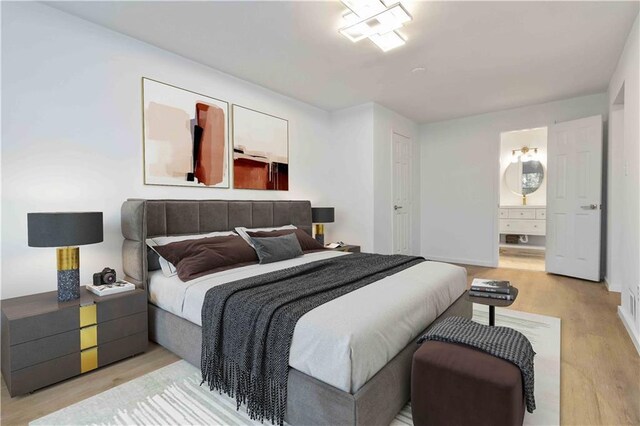 1894 Evans Dr SW, Atlanta, GA 30310 - bedroom with baseboards, ensuite bath, and wood finished floors