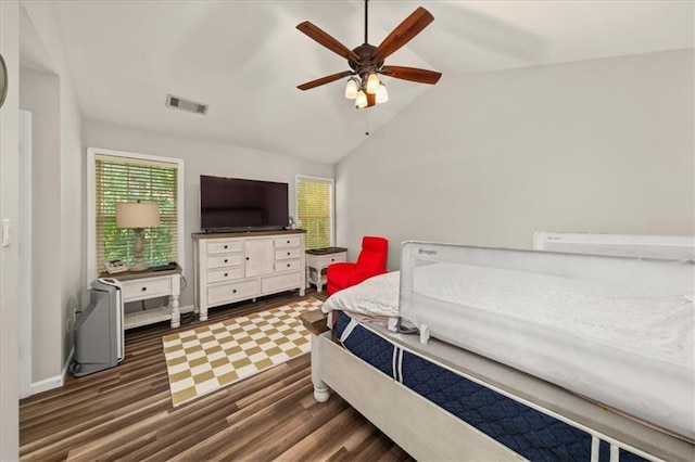 858 Red Rock Ct, Suwanee, GA 30024 - bedroom featuring dark wood-style flooring, vaulted ceiling, and a ceiling fan