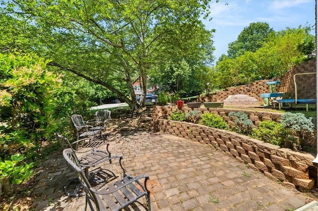 858 Red Rock Ct, Suwanee, GA 30024 - view of patio with a trampoline