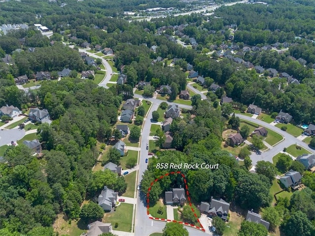 858 Red Rock Ct, Suwanee, GA 30024 - aerial perspective of suburban area featuring property boundaries highlighted and a forest