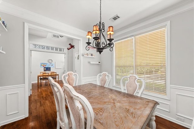 858 Red Rock Ct, Suwanee, GA 30024 - dining room with a chandelier, dark wood-style flooring, a wainscoted wall, a decorative wall, and ornamental molding