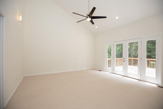 unfurnished room featuring french doors, ceiling fan, and light colored carpet