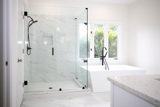 bathroom featuring an enclosed shower, vanity, and tile floors