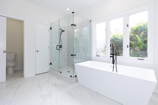 bathroom featuring tile floors, toilet, and plus walk in shower