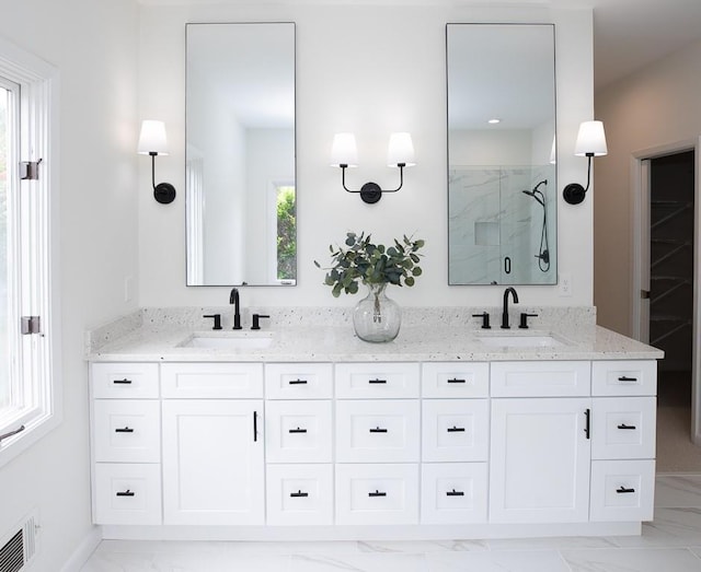 bathroom with double vanity and tile flooring