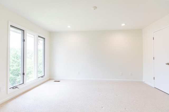 empty room with light colored carpet