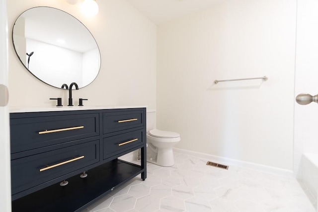 bathroom featuring toilet and large vanity