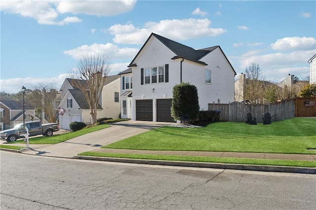 view of front of home featuring a garage and a front lawn