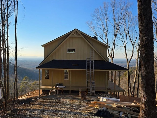 back of house featuring covered porch