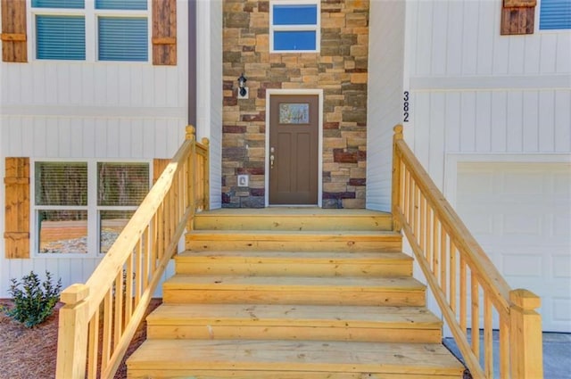 doorway to property with a garage