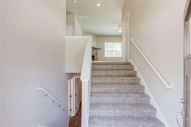 stairs with ceiling fan