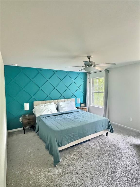 283 Wells Cir, Canton, GA 30114 - bedroom with baseboards, carpet floors, and a ceiling fan