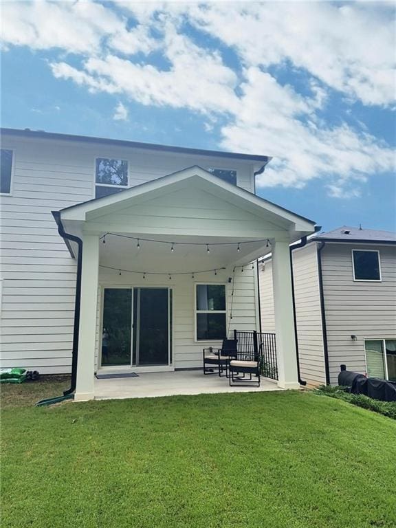 283 Wells Cir, Canton, GA 30114 - rear view of house with a patio area and a lawn