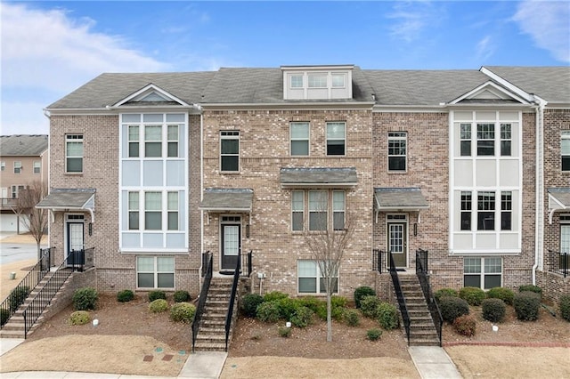 multi unit property with brick siding and stairway