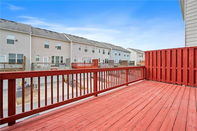 wooden deck with a residential view