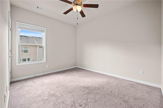 spare room featuring a ceiling fan, carpet flooring, visible vents, and baseboards