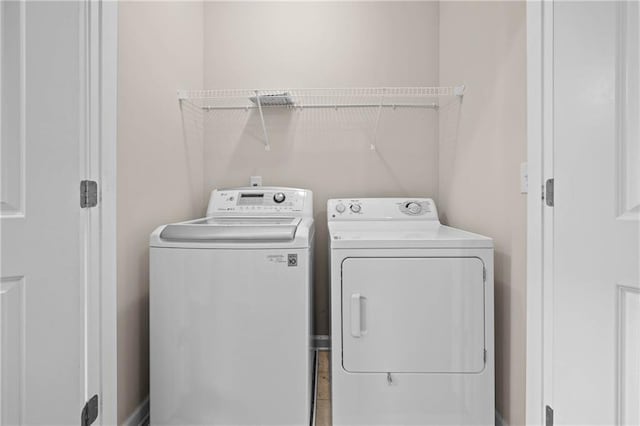 laundry room with washing machine and dryer and laundry area