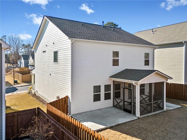 view of yard featuring a patio area and a sunroom