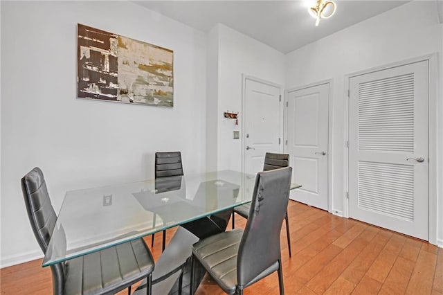 dining area with hardwood / wood-style flooring