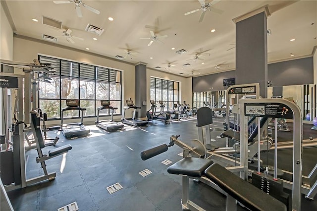 workout area featuring ornamental molding