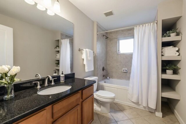 full bath with visible vents, toilet, tile patterned flooring, shower / bath combo with shower curtain, and vanity