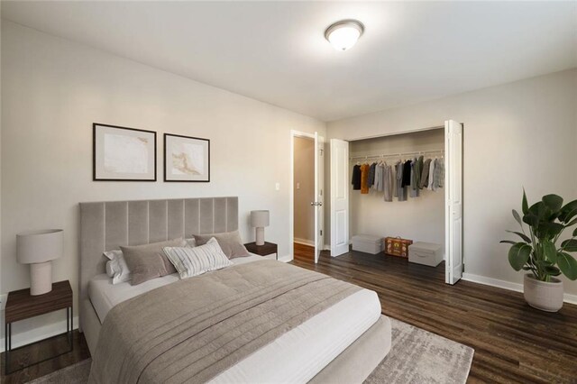 unfurnished bedroom featuring baseboards, dark wood finished floors, and a closet