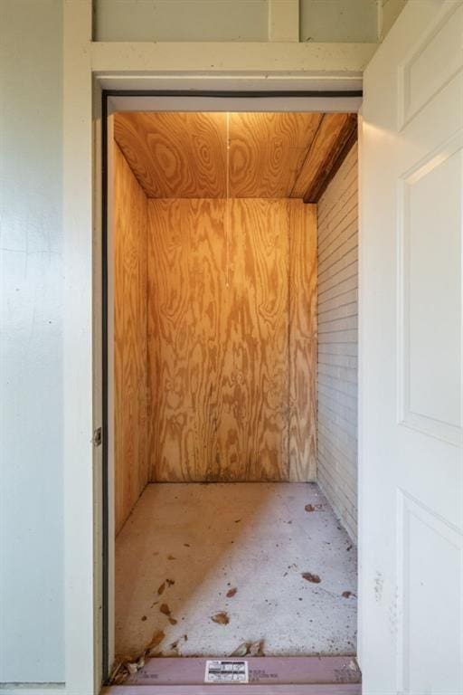 property entrance with crawl space and brick siding