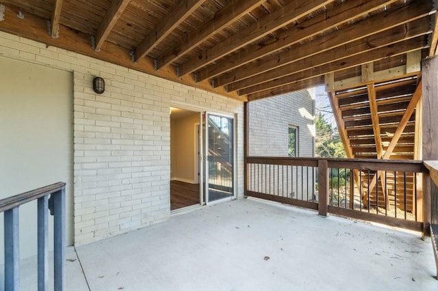 stairs with baseboards and wood finished floors