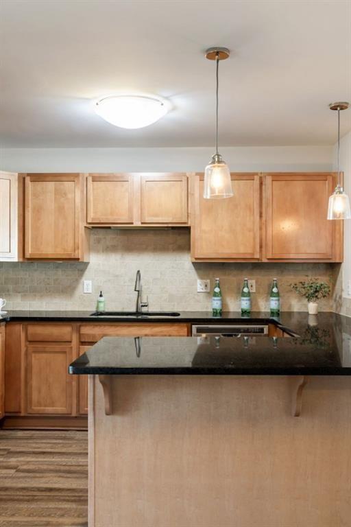 kitchen featuring tasteful backsplash, light brown cabinets, visible vents, and stainless steel appliances