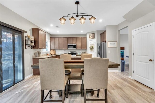 carpeted living room with ceiling fan