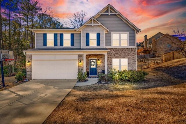 view of front of property with a garage and a front yard