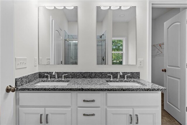 bathroom featuring vanity and walk in shower