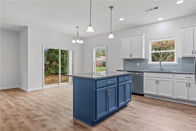 kitchen with white cabinetry, light hardwood / wood-style flooring, dishwasher, pendant lighting, and sink