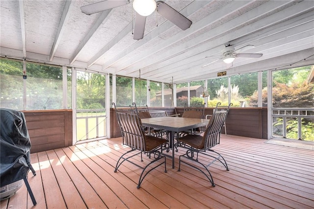 sunroom / solarium with outdoor dining area, ceiling fan, and plenty of natural light