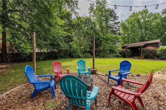 view of yard with a fire pit